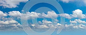 Cloudscape - Panorama of real blue sky during daytime with white light clouds Freedom and peace. Large photo format