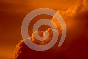 Dramatic orange thunderhead cloud