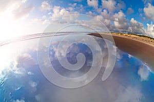 Cloudscape and reflection in Pacific ocean water