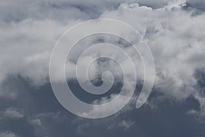 Cloudscape scenery, overcast weather above dark blue sky. Storm clouds floating in a rainy dull day with natural light. White and