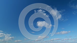 Cloudscape stratocumulus moving on beautiful bright sunny clear blue sky. Cloudscape slowly moved on daylight horizon