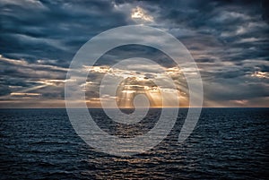 Cloudscape with sunrays over sea in London, United Kingdom. Sea on cloudy sky. Clouds on dramatic sky. Evening nature