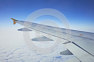 Cloudscape from window airplane, landscape of wing plane on a cloudy sky