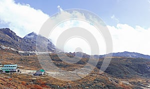 cloudy alpine landscape of nathang valley, high himalaya region of east sikkim near controversial doklam plateau