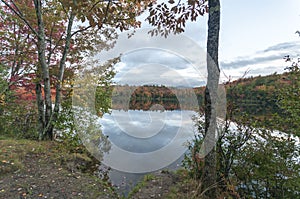 Cloudy autumn day muting colors on New Hampshire lake