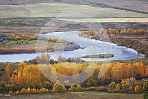 Cloudy autumn landscape with river