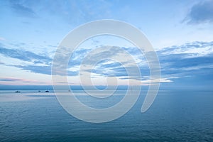Cloudy blue minimalist seascape. Deserted space with horizon line