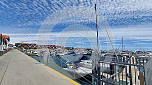 cloudy blue skies on a boats harbour