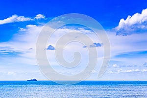 Cloudy blue sky above a battleship