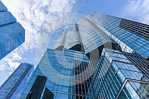 Cloudy blue sky reflection skyscraper glass exterior