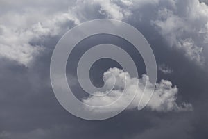 Cloudy dark blue sky abstract background in a stormy day.