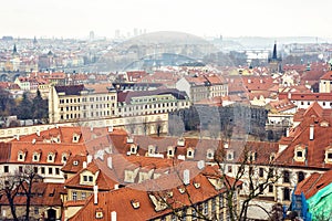 Cloudy day aerial view to clay pot roofs of Prague