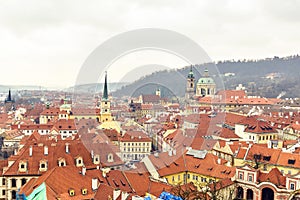 Cloudy day aerial view to clay pot roofs of Prague