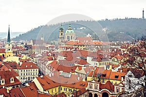 Cloudy day aerial view to clay pot roofs of Prague