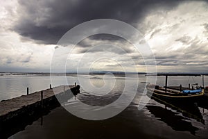 Cloudy day in the Albufera, the boats are moored