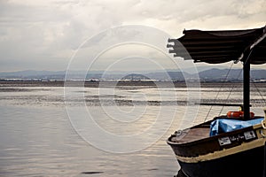 Cloudy day in the Albufera, the boats are moored