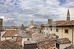 A cloudy day in Arezzo: a view of the city`s bell towers, towers, and roofs from the Confraternita dei Laici tower