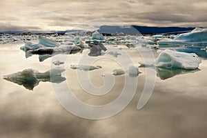 Cloudy day, blue ice lake Jokulsarlon - Iceland