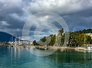 Cloudy day in chalkida bay in greece,the boats are by the coast