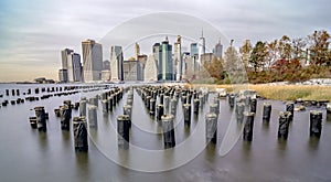 Cloudy day at lower Manhattan skyline view from Brooklyn Bridge, New York