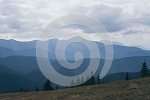 Cloudy day over Carpathian mountains with Hoverla in the center. Tonal perspective of moutain ranges