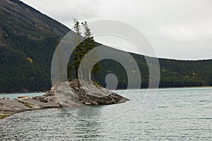 Cloudy Day on Rocky Island in Lake Minnewanka, Canadian Rocky Mountains, Banff National Park