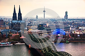 Cloudy day view of Cathedral and Hohenzollern bridge in Cologne, Germany