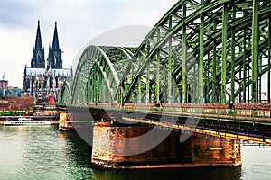 Cloudy day view of Cathedral and Hohenzollern bridge in Cologne, Germany