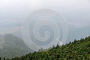 cloudy and foggy sunrise over slovakian landscape in autumn