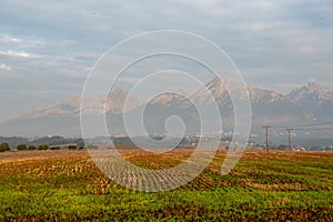 cloudy and foggy sunrise over slovakian landscape in autumn