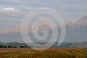 cloudy and foggy sunrise over slovakian landscape in autumn