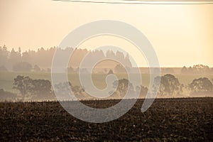 cloudy and foggy sunrise over slovakian landscape in autumn