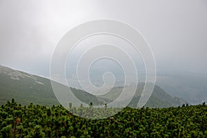 cloudy and foggy sunrise over slovakian landscape in autumn