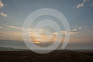 cloudy and foggy sunrise over slovakian landscape in autumn