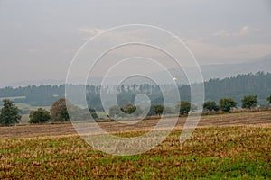 cloudy and foggy sunrise over slovakian landscape in autumn