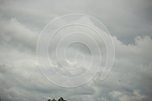 Cloudy sky full of deep grey clouds. Storm is coming.