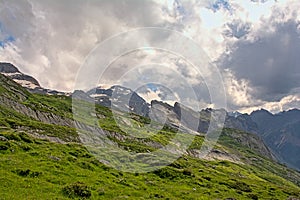 Cloudy mountain tops with glaciers   in the French Alps