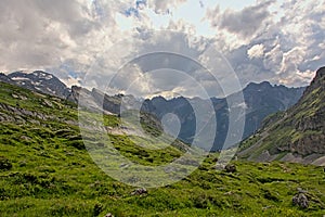 Cloudy mountain tops with glaciers   in the French Alps