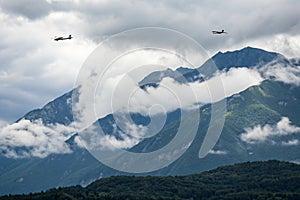 Cloudy mountains and planes passing by
