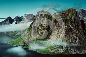 Cloudy mountaintops of fjords