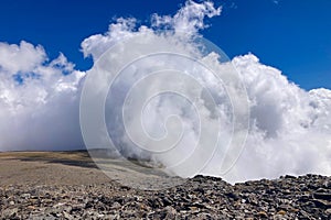 Cloudy over mountains on hiking trail to Mulhacen peak photo