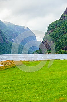 Cloudy rainy mountains and fjord in Norway,