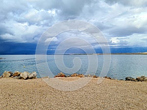 Cloudy and Rainy Sky Above the See