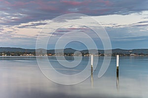 Cloudy Reverse Sunrise Waterscape over the Bay