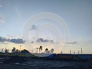 Cloudy and shinning landscape with train