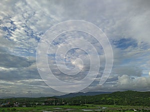 Cloudy sky beautiful cloud greenary blue sky photo