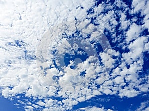 Cloudy sky. Clear weather. Perfect blue sky. Cumulus clouds. Nimbus clouds. Summer Daytime photo.