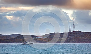 Cloudy sky over the bay near the village of Teriberka on the coast of the Barents Sea. Kola Peninsula, Russia