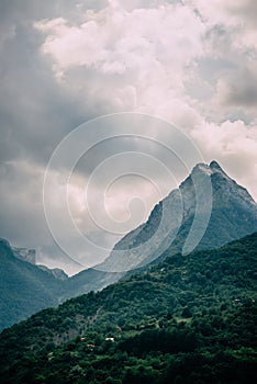 Cloudy sky over mountain peaks.