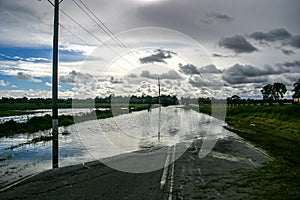 A cloudy sky reflecting in the flood waters across Heatherton Road highway in Dandenong